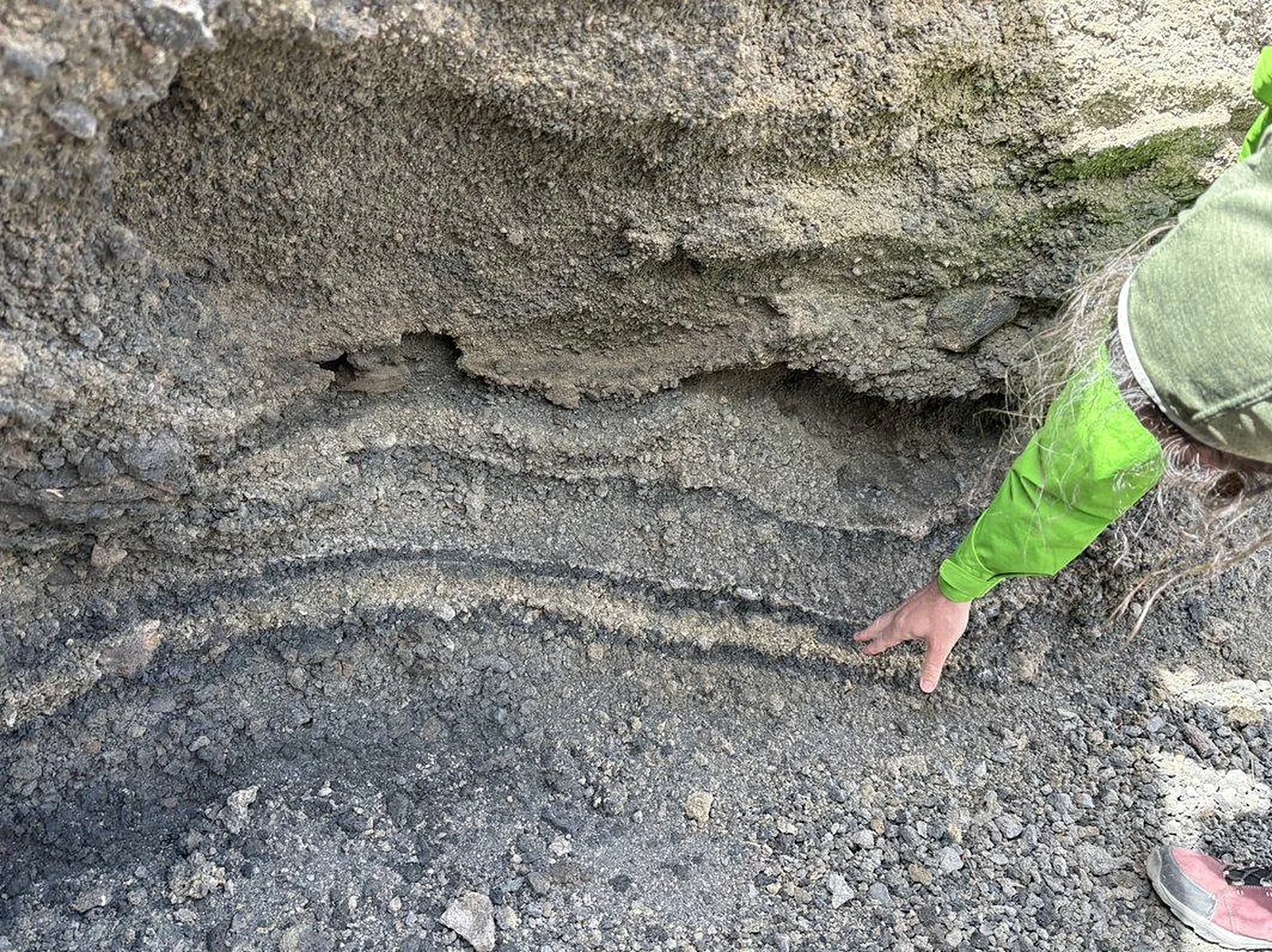 Examining volcanic sediment stratigraphy in the field