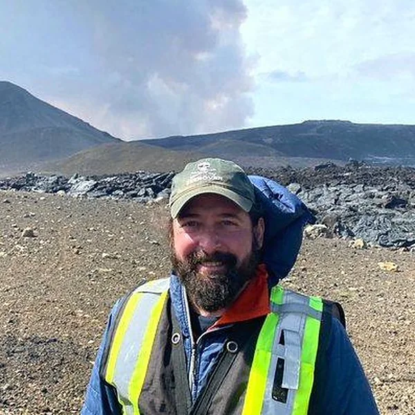 Christopher Hamilton with volcanic plume